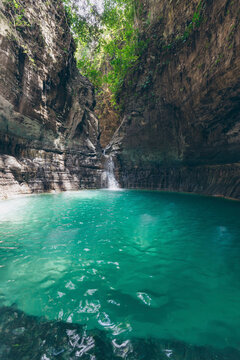 Stunning lagoon and waterfall at Air Terjun Wai Marang on the island of East Nusa Tenggara, Indonesia; Ngaru Kanoru, Umalulu, East Sumba Regency, East Nusa Tenggara, Indonesia