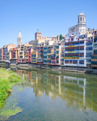 Girona, Spain - 23 July, 2024: Colored houses on River Onyar, Girona, Catalonia