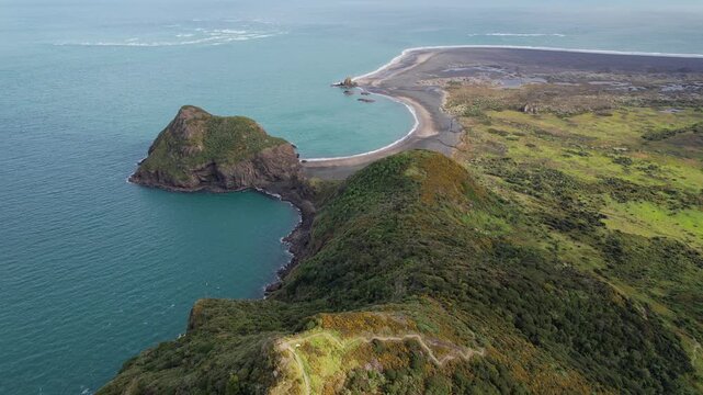Omanawanui Track With View Of Paratutae Island, Whatipu Beach, And Ninepin Rock In Auckland, New Zealand. aerial shot