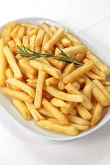 French fries in bowl seen from above on white background