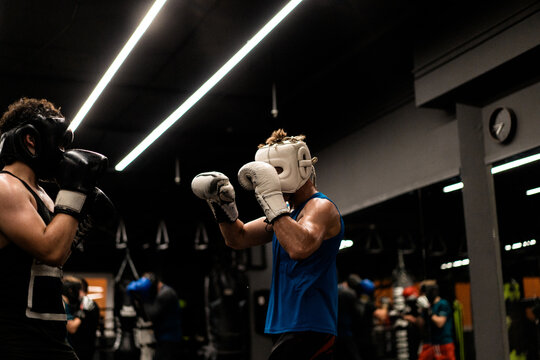 Boxers fighting in boxing training in the gym.