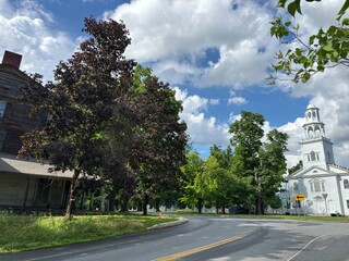 Street view with historic church and house in Bennington, VT