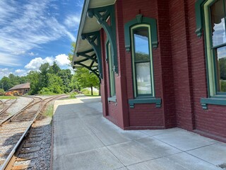 Red-brick train station in North Bennington, Vermont, tracks curving