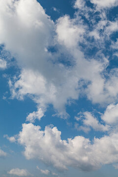 Clouds illuminated with soft light in a blue sky; United States of America
