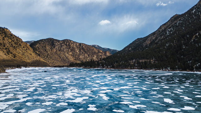 Ice racing on a frozen lake in Colorado, surrounded by mountains
