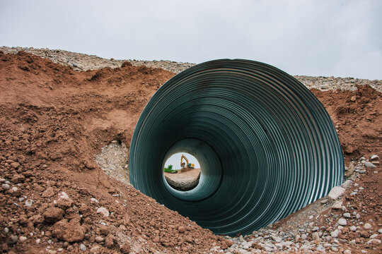 Wide angle of excavator moving dirt.