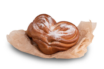 Sweet bun with sugar in the shape of a heart, isolated on a white background, top view
