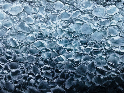Ice forms and breaks on a lake in the winter
