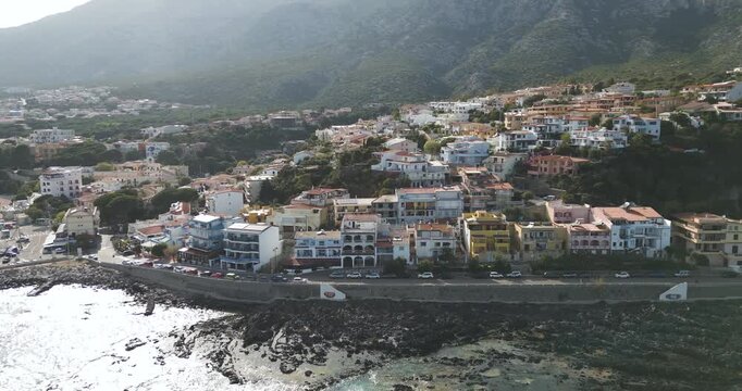 Seaside Village Cala Gonone On Shore Of Bay Of Orosei In Dorgali, Sardinia, Italy. aerial shot