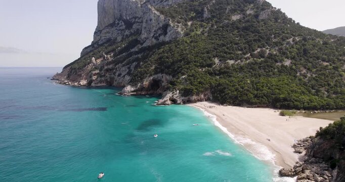 Beautiful Scenery At Cala Sisine on Baunei Coast In Italy. Turquoise Water And Dramatic Cliffs.