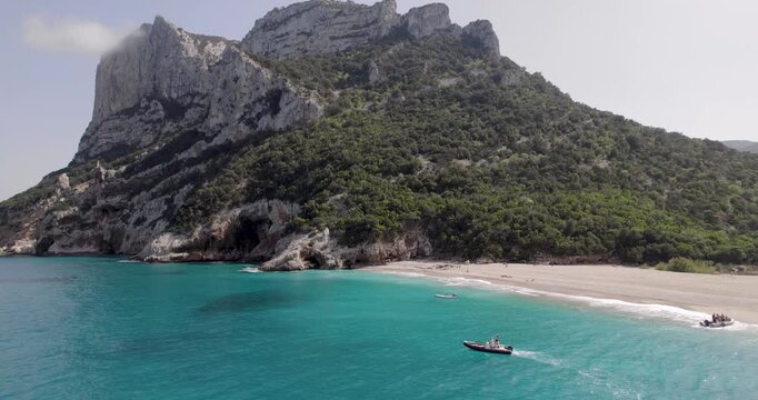 Boats And Mountain Cliff In Beautiful Ocean Landscape At Cala Sisine In Sardinia, Italy.