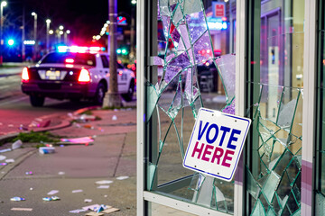 Vote Here sign on broken glass window at polling place. Fictitious depiction, artist's impression. Civil unrest in election, USA