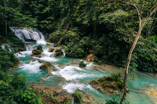 Beautiful waterfall and cascades with lush vegetation at Air Terjun Laumarang in Indonesia; Bukit Mambual, Luwuk, Banggai Regency, Central Sulawesi, Indonesia