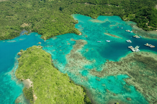 Harbour in the turquoise waters of Molucca Sea off the coast of Borgo Satu in North Sulawesi, Indonesia; Borgo Satu, Belang, Southeast Minahasa Regency, North Sulawesi, Indonesia