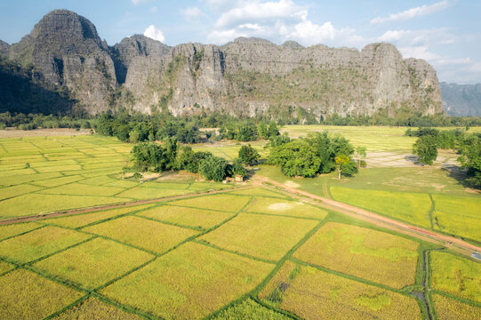 Limestone karst and rice fields in a valley near Kong Lor Cave in Laos; Khammouane Province, Laos