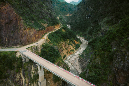 Road spanning a gorge with river below; Nam Pam, Muong La District, Son La, Vietnam