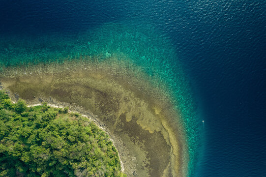 View over Dutungan Island and the stunning colours along the coastline; Dutungan Island, Kecamatan Mallusetasi, Kabupaten Barru, Sulawesi Selatan, Indonesia