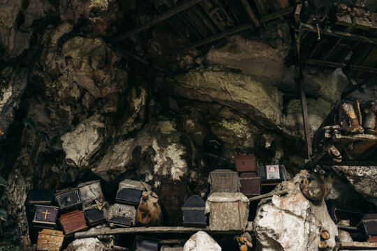 Londa Ancient Graveyard with offerings in the interior in Sulawesi Selatan, Indonesia; Kecamatan Kesu, Kabupaten Toraja Utara, Sulawesi Selatan, Indonesia