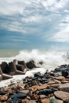 Waves crash into the rocky shore at Bai bien Tu Lam, along the East Sea, Vietnam; Bai bien Tu Lam, Mui Ne, Vietnam