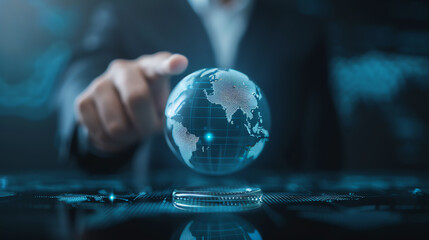 Businessman in a formal suit pointing at Asia on a globe in a hightech office