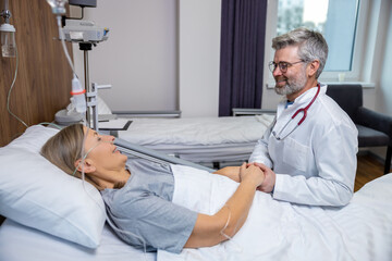 Doctor talking to a patient and holding her hands