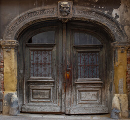 Old wooden door of ancient abandoned architecture in Zagreb, Croatia. 
