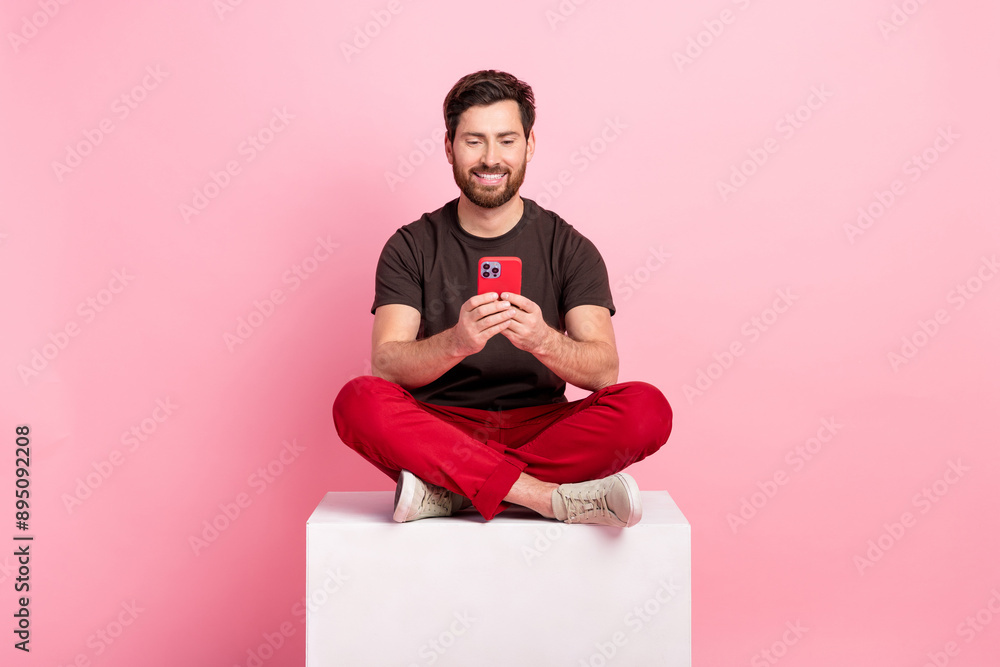 Aufkleber full size photo of nice man dressed brown t-shirt sit on cube look at smartphone read notification i