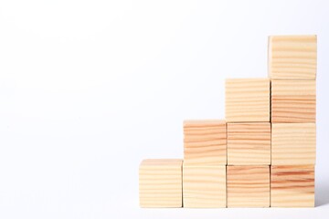 Many blank wooden cubes on white background, space for text
