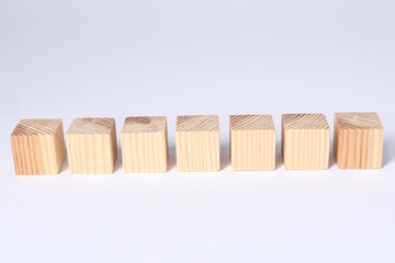 Many blank wooden cubes on white background