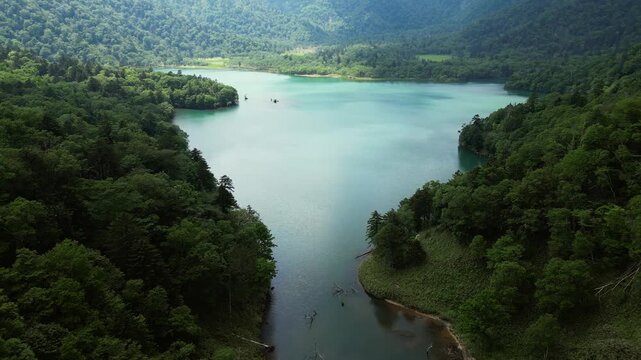 Okotanpe Lake, Hokkaido: Aerial cinematic footage of the Okotanpe Lake in the Shikotsu Toya National Park in southern Hokkaido in summer in Japan.