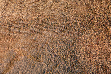 texture of shallow water in yellow