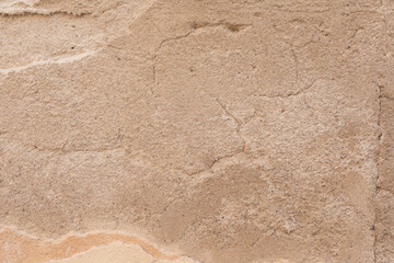 A weathered wall with a natural pattern of cracks