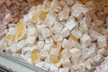 Turkish traditional jelly cubes sugar powder covered dessert on bazaar shop stand