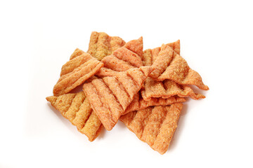 Stack of triangle shaped lentil chips snack isolated on white background. 
