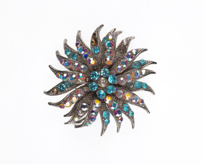 jewelry brooch with precious stones isolated on white background