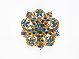 jewelry brooch with precious stones isolated on white background