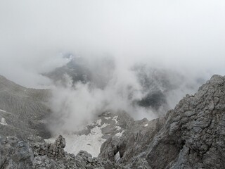 Wide panoramic view of Grosser Priel mountain peak in the Austrian Alps surrounded by rocky ridges and alpine nature.

