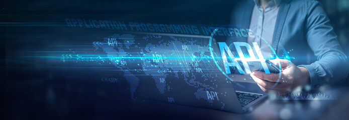 Businessman using laptop and mobile on global network connection of API integration, real-time data exchange, Globalization dynamics and emerging technology, digital business, automation, innovation.