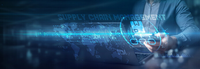 Businessman using laptop and mobile on global network connection of supply chain management (scm)...