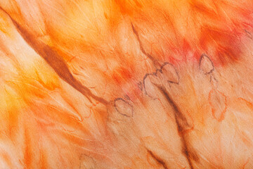 abstract pattern on silk fabric texture in yellow and brown tones
