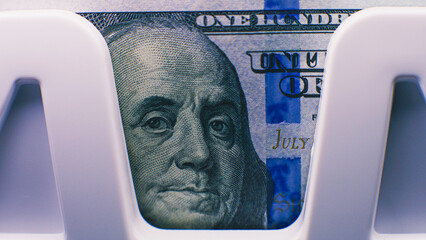 Cash counting machine counts hundred dollar bills for currency exchange. Automatic counting...