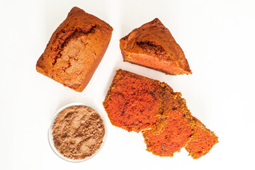 Brioche or bread with beetroot on a white background and a bowl with ingredients