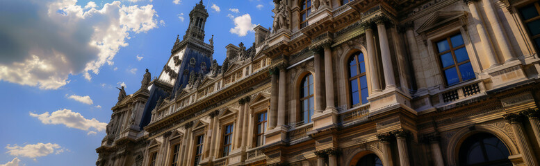 Obraz premium Olympic rings in front of the Haussmannian building with statues, Paris city hall, sunny day,