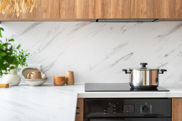 Modern kitchen interior with pot on stove top