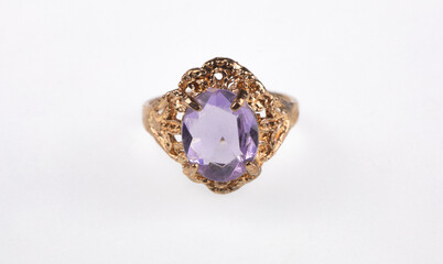 gold ring with amethyst isolated on white background