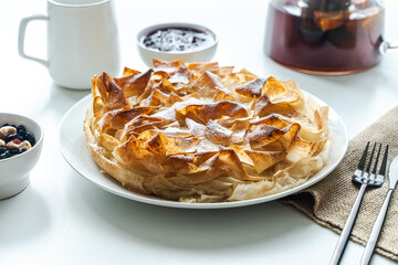 Sweet pie, homemade pastries on a light background. Selected focus. Close-up.