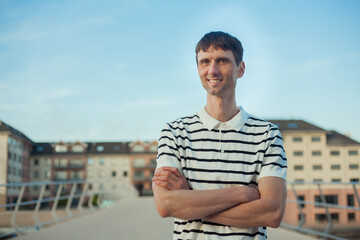 joyful cheerful middle-aged man in nature on a warm sunny day