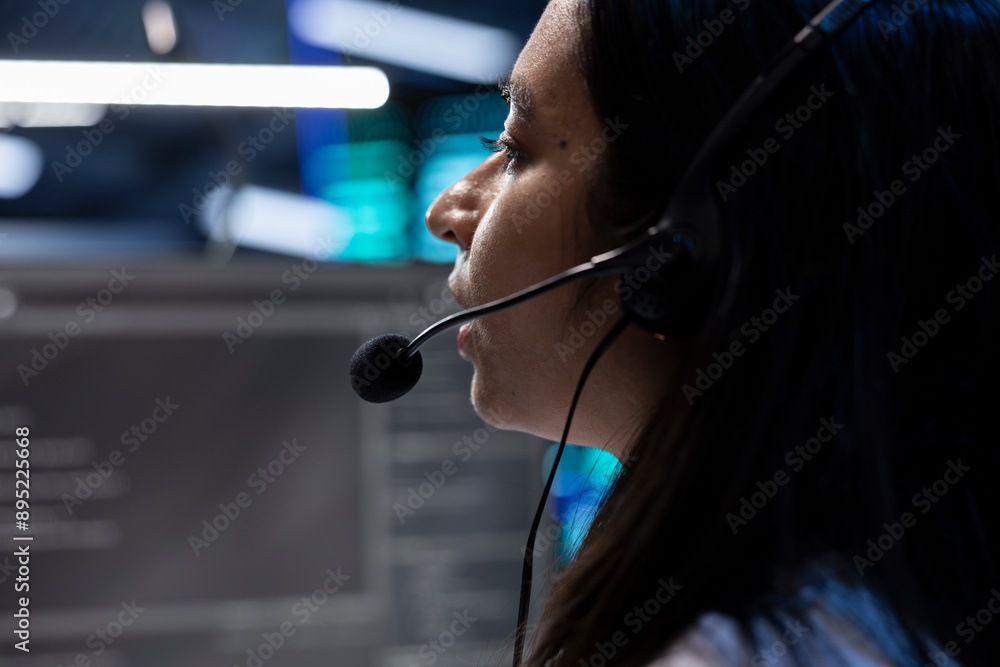 Poster data center operator assisting project teams with complex installations, issuing commands though hea