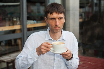 joyful cheerful middle-aged man in nature on a warm sunny day