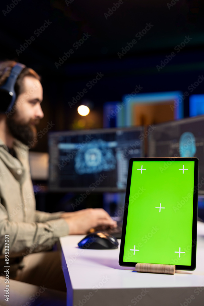 Poster focus on chroma key tablet with sentient ai in blurry background gaining humanoid form. isolated scr